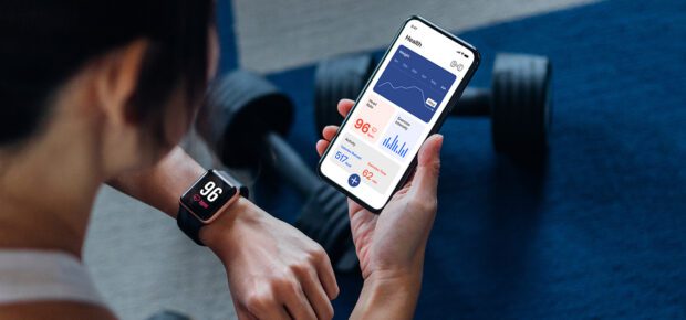 image of smart phone and smart watch synching health data