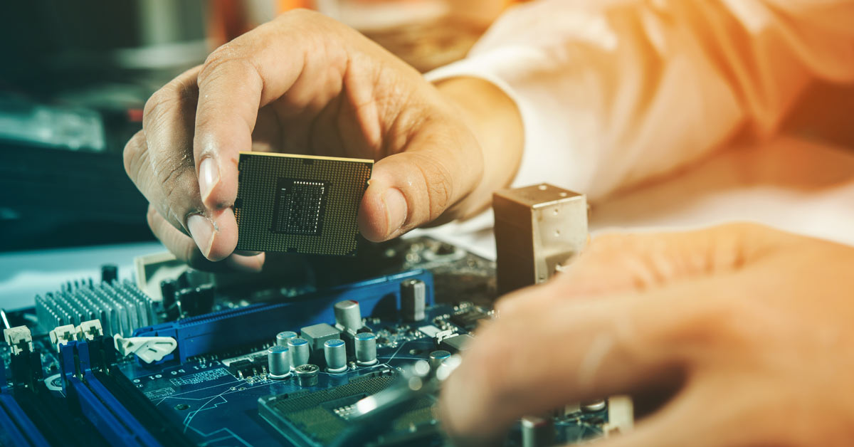 Engineer putting CPU in computer