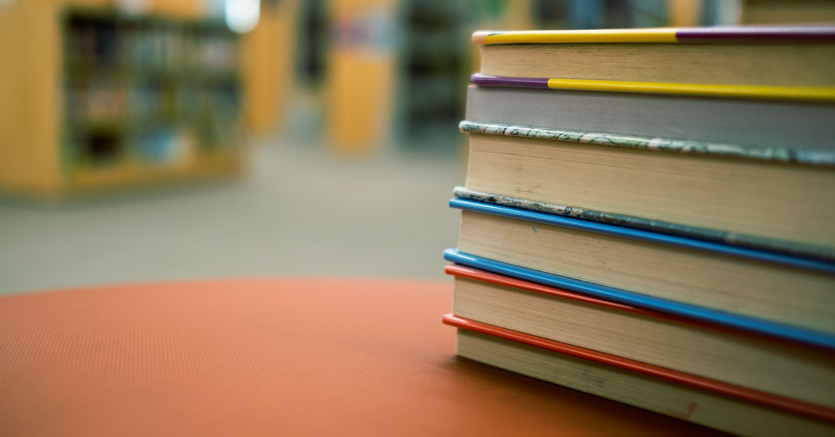 Stack of books on a table.