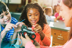 Children in classroom learning STEM