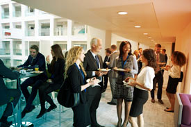 Corporate cafeteria with people eating